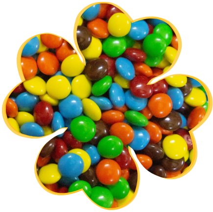 pile of candy-coated chocolates in many colors and chocolate flavors