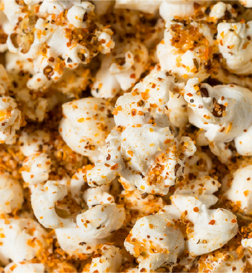Seasoned popcorn dusted with spices, a global-inspired twist on a familiar snack