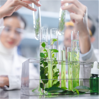 Researcher with glassware, representing clean encapsulation that protects fragile aromas