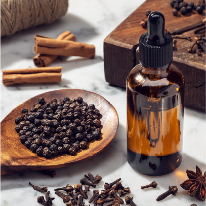 Black pepper and amber dropper, illustrating botanical extracts