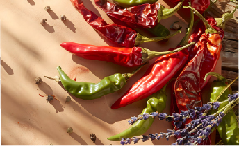 Fresh red chili peppers highlighting the global rise of heat and spice fusion in foods.