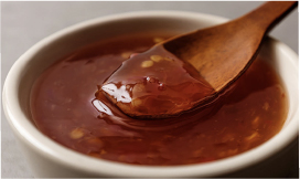 Single‑serve bowl of pecans and nuts, illustrating a quick solo snack sized for portion‑conscious consumers