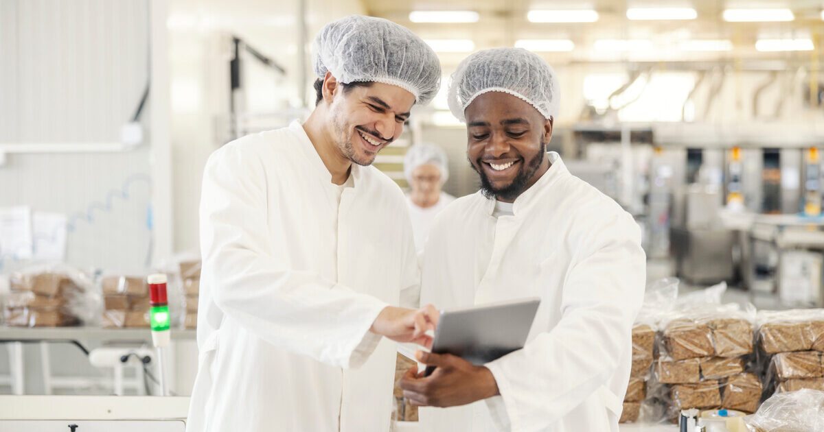 Food scientist in a lab with produce and samples, showing flavor innovation guided by the science of taste