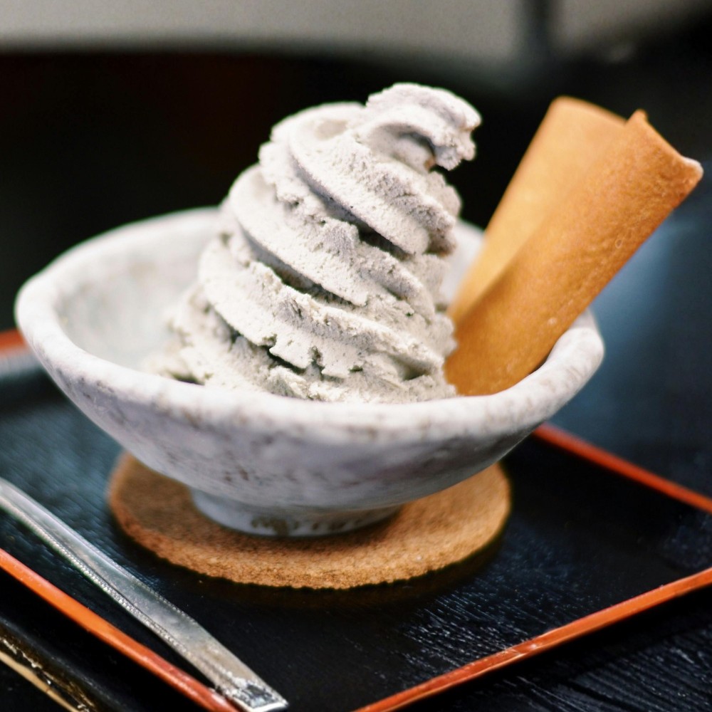 Black sesame jasmine frozen dessert, balancing roasted seed depth with restrained sweetness and floral lift.