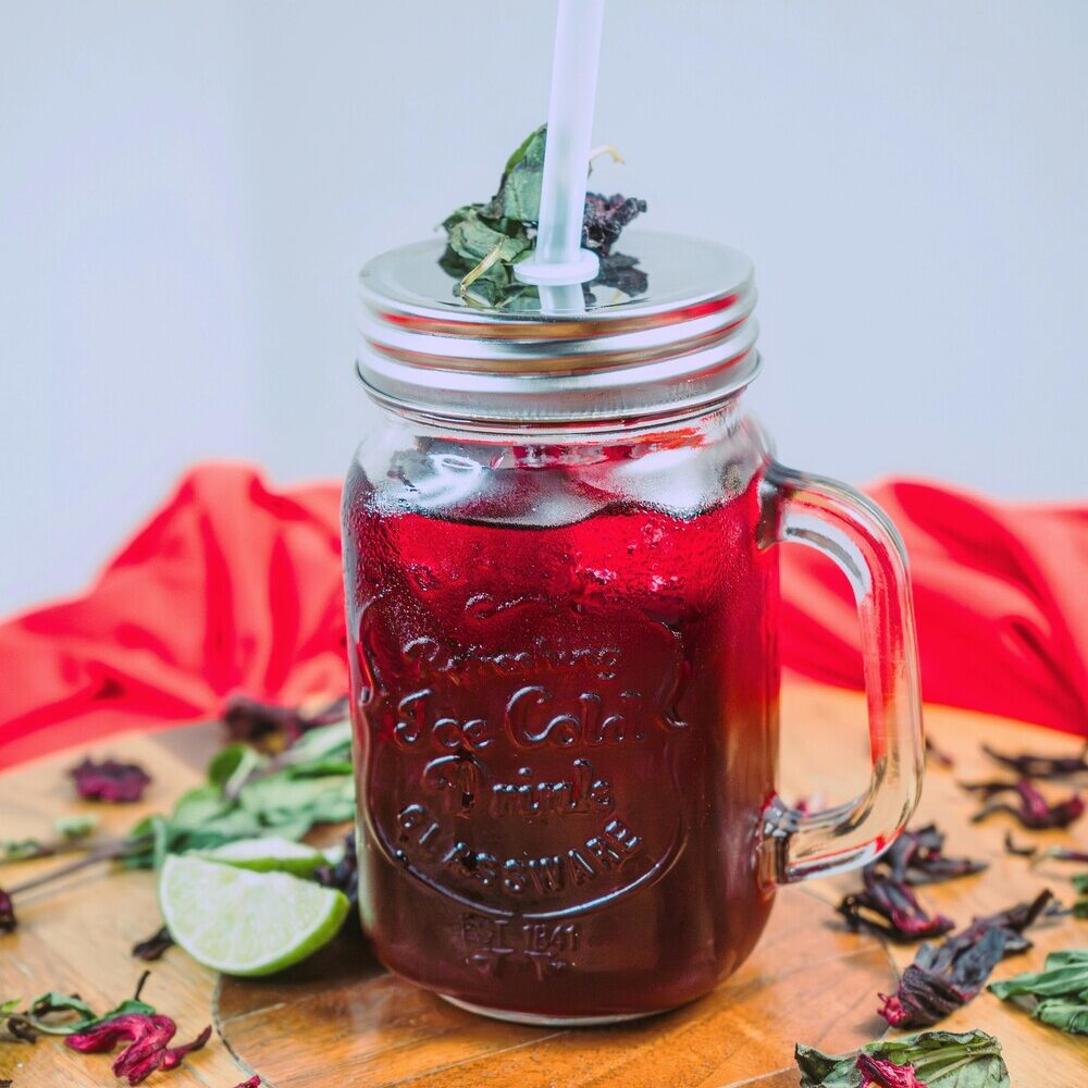 Ruby hibiscus drink with bergamot and citrus peel, with color and flavor sensitive to heat, light, and oxygen.