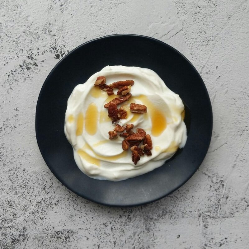 Chamomile honey yogurt with nuts, showing cultured acidity and protein can flatten delicate floral top notes.
