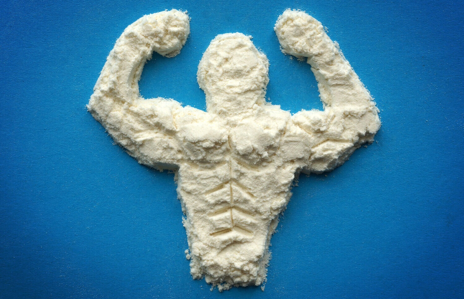 Protein powder shaped like a flexing bodybuilder, showing how protein flavor can overpower aroma release.